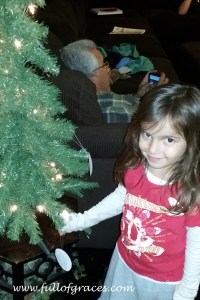 This sweet face is Clare, Steffani's youngest, putting an ornament on the Jesse tree.