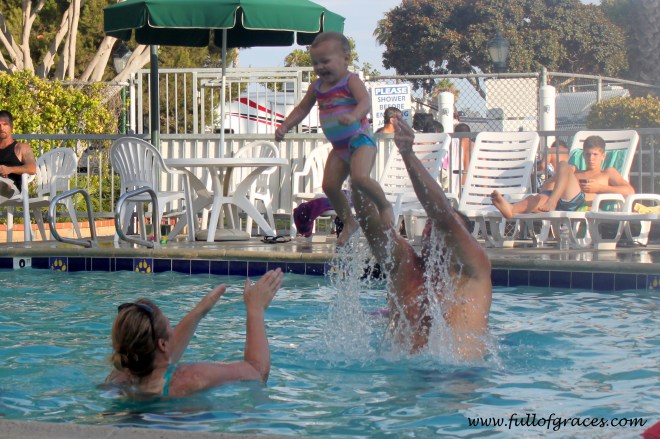 If you don't get in the pool, you can't hurl your one year old across the pool. But look at her face!